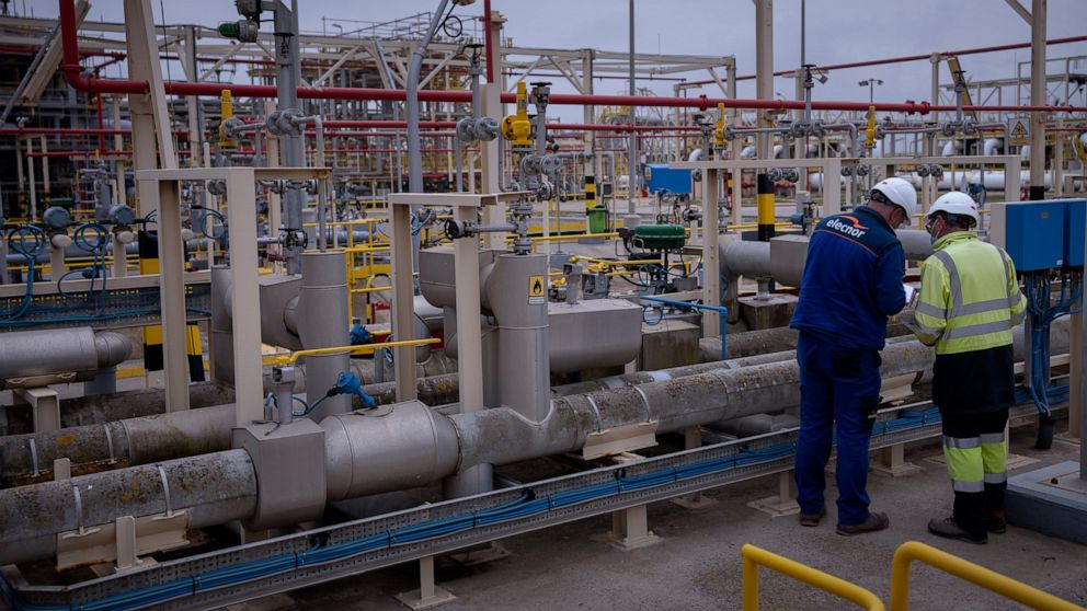 FILE - Operators work at Enagas regasification plant, the largest LNG plant in Europe, in Barcelona, Spain, Tuesday, March 29, 2022. The Spanish government on Friday approved a new plan aimed at reining in soaring energy prices, signing off on a temp