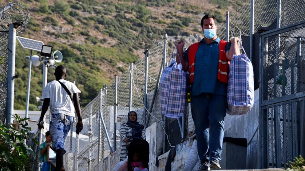 Greek authorities begin moving migrants into new camp