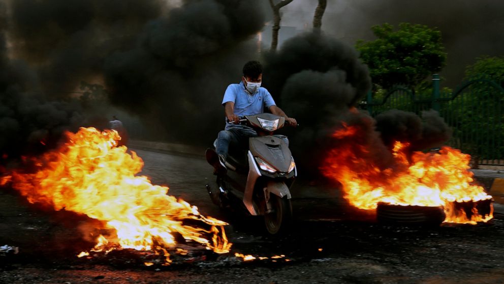 Gunmen take to streets in Lebanese city over economic crisis