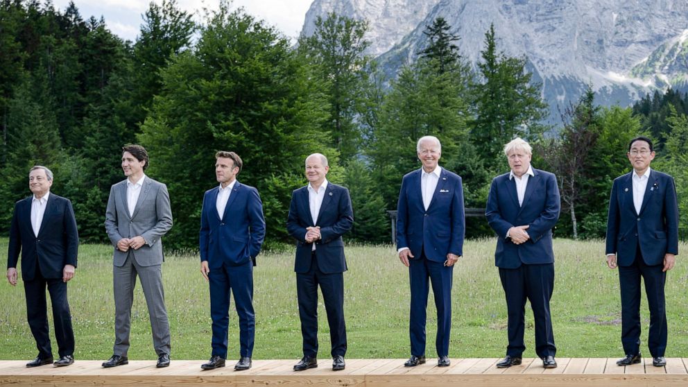 From left, Italy's Prime Minister Mario Draghi, Canada's Prime Minister Justin Trudeau, France's President Emmanuel Macron, Germany's Chancellor Olaf Scholz, US President Joe Biden, Britain's Prime Minister Boris Johnson and Japan's Prime Minister Fu