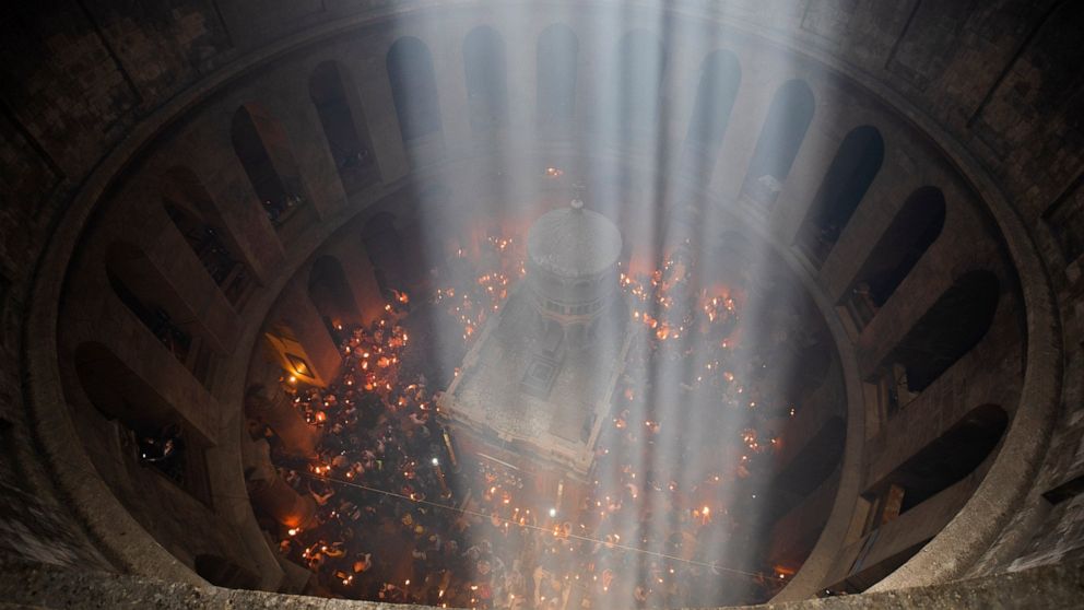 Vaccinated faithful throng Jerusalem church for Holy Fire
