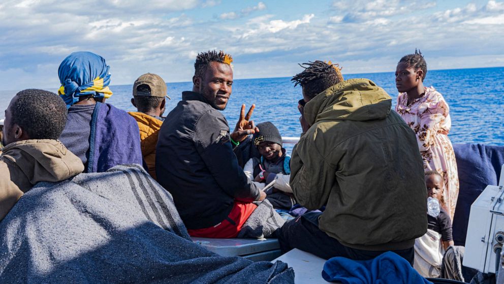 Migrants on the deck of the Rise Above rescue ship run by the German organization Mission Lifeline, in the Mediterranean Sea off the coasts of Sicily, southern Italy, Sunday, Nov. 6, 2022. Italy allowed one rescue ship, the German run Humanity 1, to 