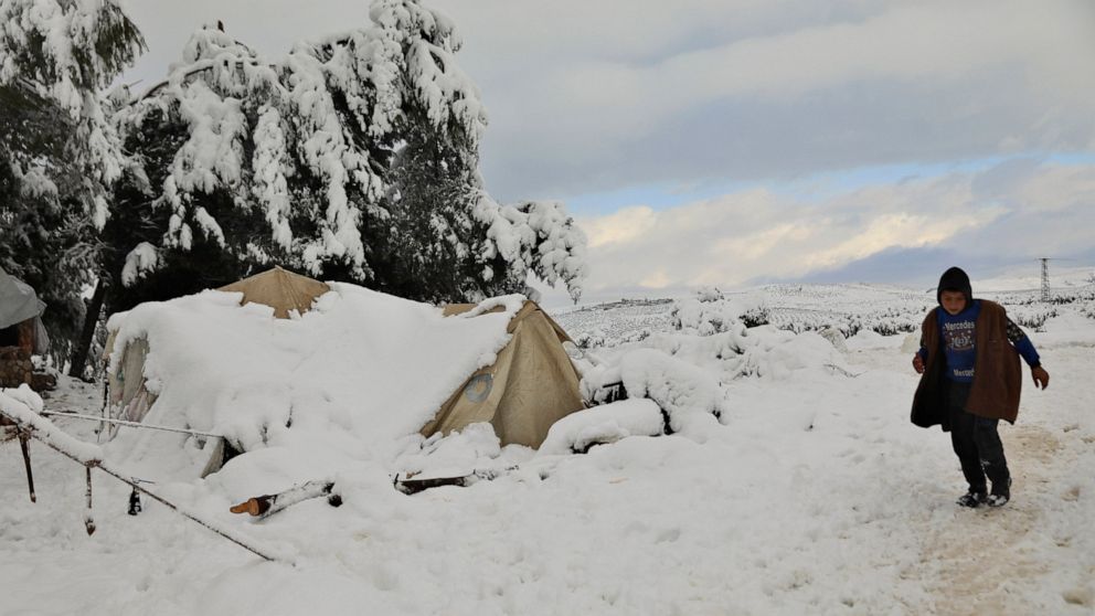 Impoverished Lebanese, Syrians struggle to survive cold