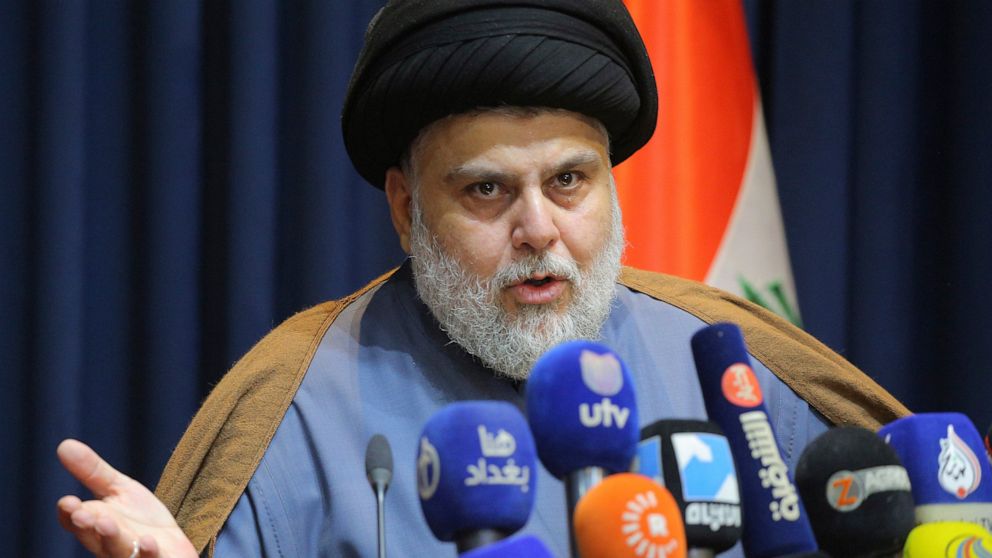 FILE - Populist Shiite cleric Muqtada al-Sadr, speaks during a mews conference in Najaf, Iraq, Thursday, Nov. 18, 2021. On Sunday, June 12, 2022, 73 lawmakers from the powerful cleric’s bloc submitted their resignation based on his request, to protes