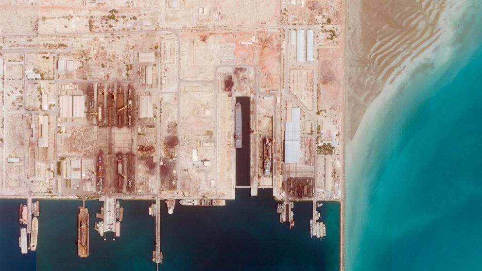 This satellite photo from Planet Labs PBC shows the Iranian Revolutionary Guard's newest ship, the Shahid Mahdavi, center right, under construction in a shipyard west of Bandar Abbas, Iran, Saturday, May 21, 2022. Iran's paramilitary Revolutionary Gu