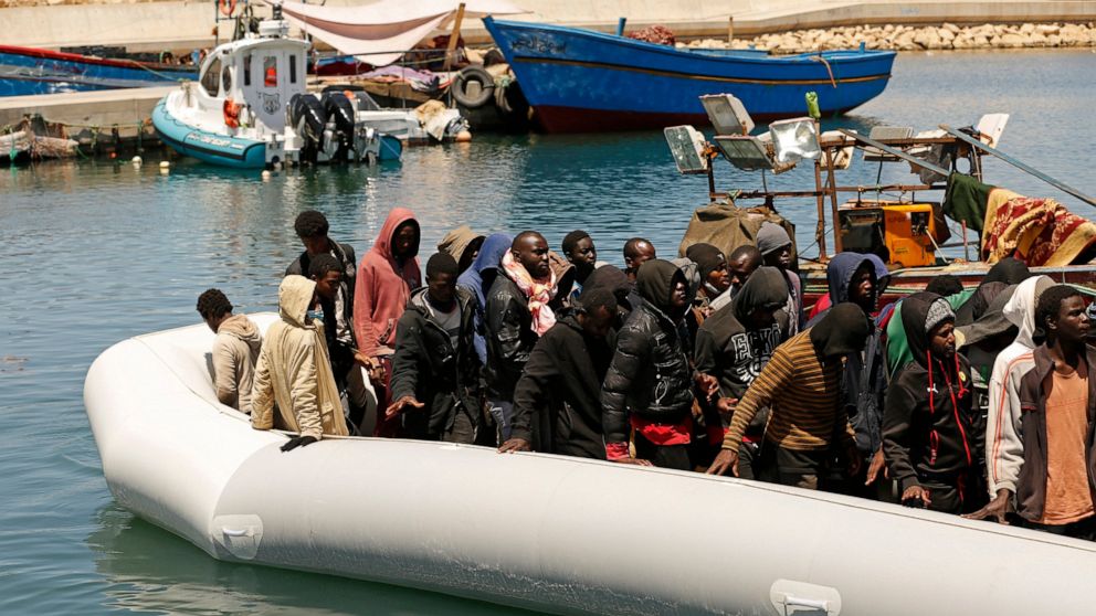 FILE - Migrants heading to Europe are brought back to port after being intercepted in the Mediterranean Sea by the Libyan coast guard, in Gasr Garabulli, northwestern Libya, May 23 2022. Though migrants have long faced torture and extortion in the Li