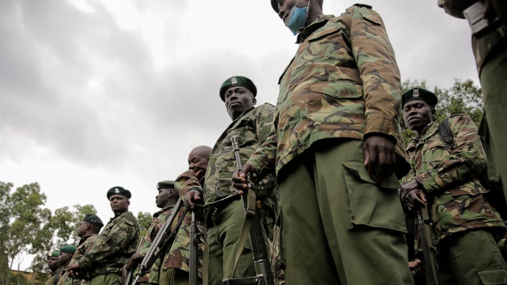 Policemen line up as they prepare to provide security for polling stations in Eldoret, western Kenya Monday, Aug. 8, 2022. Kenya is voting Tuesday in an election that will bring East Africa's economic hub a new president. (AP Photo/Brian Inganga)