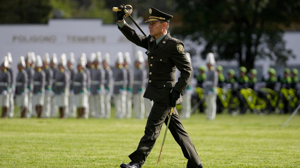 FILE - New Colombian police chief, Gen. Henry Sanabria, parades during his swearing in ceremony in Bogota, Colombia, Friday, Aug. 19, 2022. Colombia has suspended forced eradication of coca fields and will focus on intercepting cocaine shipments whil