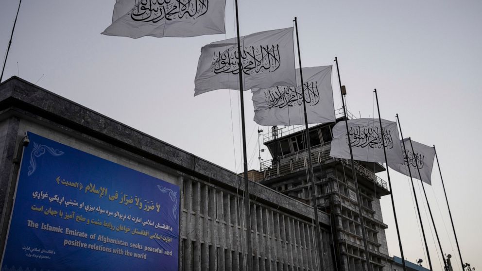 FILE - Taliban flags fly at the airport in Kabul, Afghanistan, Sept. 9, 2021. The Taliban announced a deal Tuesday, May 24, 2022, allowing the Abu Dhabi-based firm GAAC Solutions to manage the airports in Herat, Kabul and Kandahar. However, the Unite