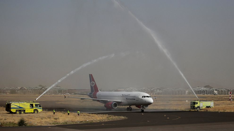 A Yemen Airways plane is greeted with a water spray salute at the Sanaa international airport in Sanaa, Yemen, Monday, May, 16, 2022. The first commercial flight in six years took off from Yemen’s rebel-held capital on Monday, officials said, part of