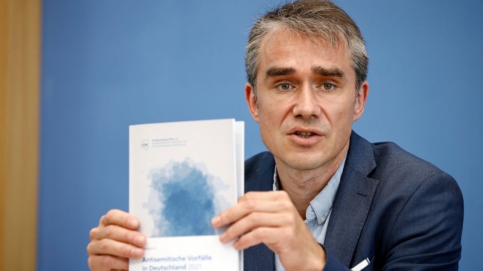 Benjamin Steinitz, executive director of the 'Bundesverband RIAS', shows the annual report at a press conference to present the annual report 'Anti-Semitic Incidents in Germany 2021' during a press conference in Berlin, Germany, Tuesday June 28, 2022
