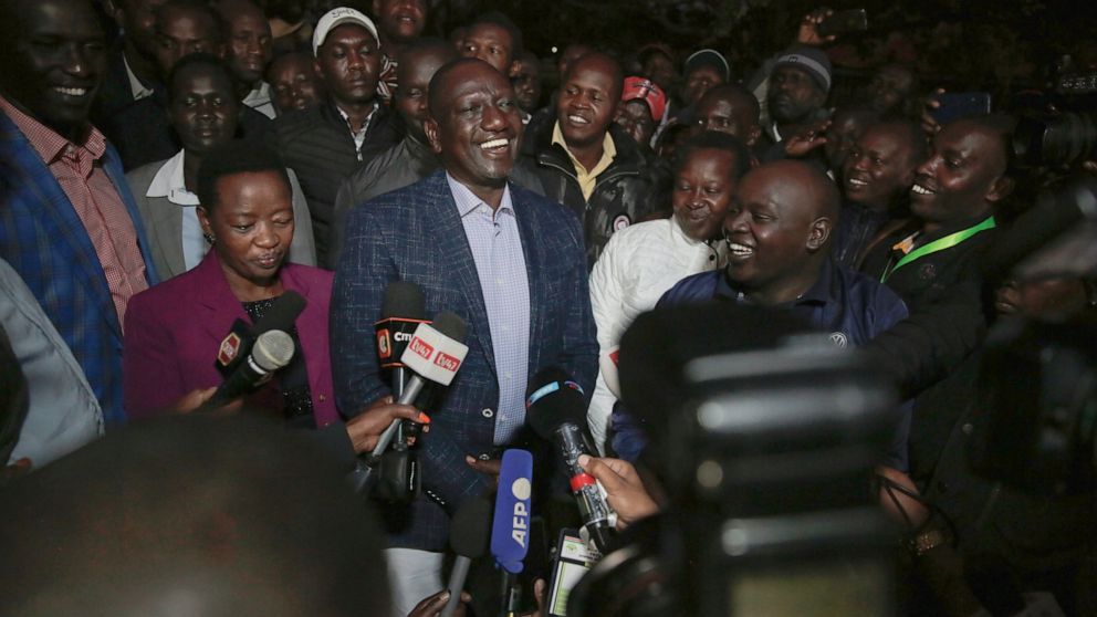 Deputy President and presidential candidate William Ruto, center, speaks to reporters after casting his vote in Kenya's general election in Sugoi, 50 kms (35 miles) north west of Eldoret, Kenya, Tuesday Aug. 9, 2022. Kenyans are voting to choose betw