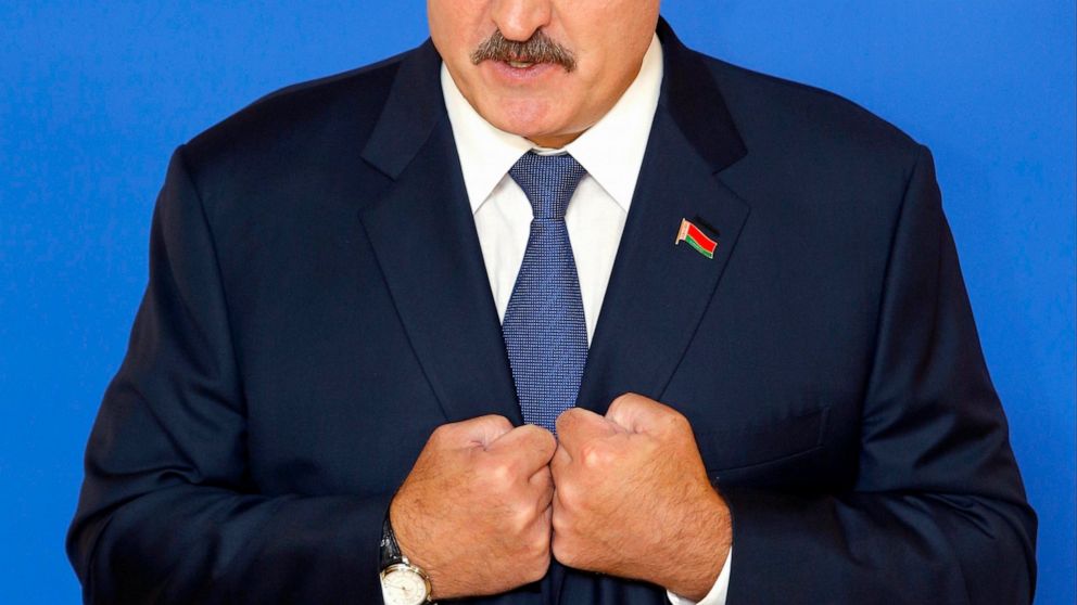 FILE - Belarusian President Alexander Lukashenko speaks to the media at a polling station after voting during the presidential election in Minsk, Belarus on Sunday, Oct. 11, 2015. For most of his 27 years as the authoritarian president of Belarus, Al