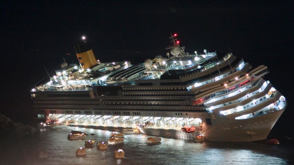 FILE — The luxury cruise ship Costa Concordia lays on its starboard side after it ran aground off the coast of the Isola del Giglio island, Italy on Jan. 13, 2012. Italy is marking the 10th anniversary of the Concordia disaster with a daylong commemo