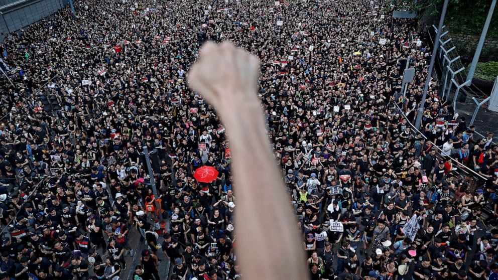FILE - In this June 16, 2019, file photo, protesters march on the streets against an extradition bill organized by Civil Human Right Front in Hong Kong. Pro-democracy group, Civil Human Rights Front that organized some of the biggest protests during 