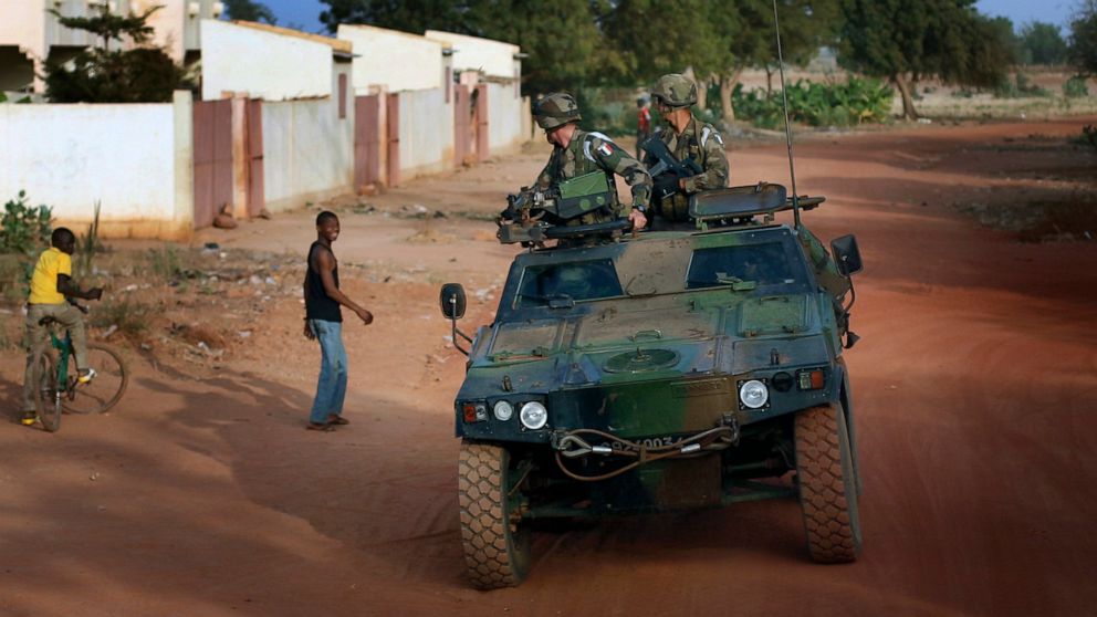 FILE - French soldiers return from patrol in Sevare, some 620 kms (400 miles) north of Mali's capital Bamako, Thursday, Jan. 24, 2013. French President Emmanuel Macron announced at a press conference Thursday Feb. 17, 2022 that he is withdrawing Fren