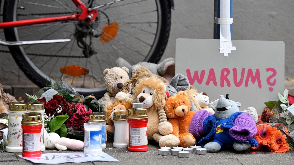 FILE-Teddy bears and candles are pictured at the entrance of an apartment building where five dead children were found in Solingen, Germany, Friday, Sept. 4, 2020. A 28-year-old German mother has been found guilty and sentenced to life in prison for 