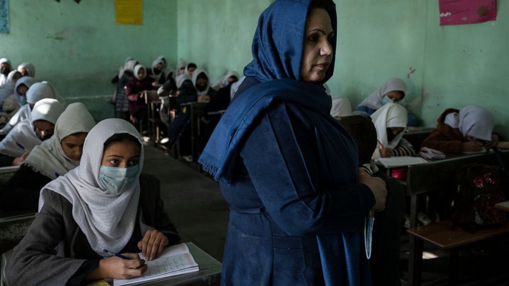 Afghan girls listen their teacher at Tajrobawai Girls High School, in Herat, Afghanistan, Thursday, Nov. 25, 2021. While most high school girls in Afghanistan are forbidden to attend class by the country's Taliban rulers, one major exception are thos