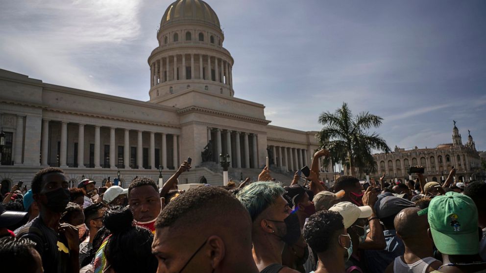 FILE - People protest against ongoing food shortages and high food prices, in front of the Capitol in Havana, Cuba, July 11, 2021. Cuba enacted a new penal code that activists and human rights organizations warned on Friday, Dec. 2, 2022, could furth