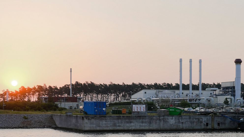 The sun rises behind the landfall facility of the Nord Stream 1 Baltic Sea pipeline and the transfer station of the OPAL gas pipeline, the Baltic Sea Pipeline Link, in Lubmin, Germany, Thursday, July 21, 2022. The operator of the major pipeline from 