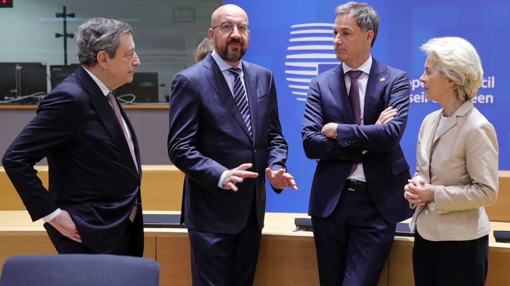 From left: Italian Premier Mario Draghi, European Council President Charles Michel, Belgium's Prime Minister Alexander de Croo and European Commission President Ursula von der Leyen talk before the second day's session of an extraordinary meeting of 