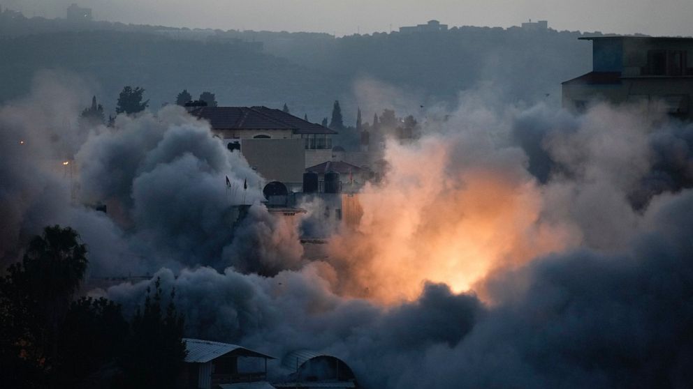 Israeli troops blow up the house of Palestinian militant Diaa Hamarsheh in the West Bank village of Yabed, Thursday, June 2, 2022. Hamarsheh was shot and killed by Israeli police after he killed three Israelis and two Ukrainian citizens in a deadly s