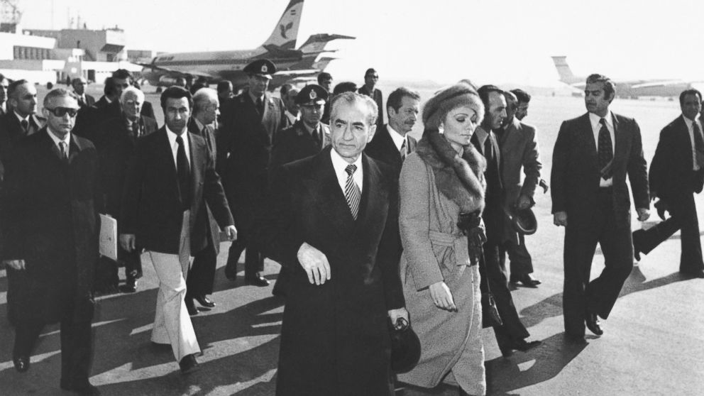FILE - In this Jan. 16, 1979 file photo, Shah Mohammad Reza Pahlavi and Empress Farah walk on the tarmac at Mehrabad Airport in Tehran, Iran, to board a plane to leave the country. Wednesday, Jan. 16, 2019 marks the 40th anniversary of the shah aband
