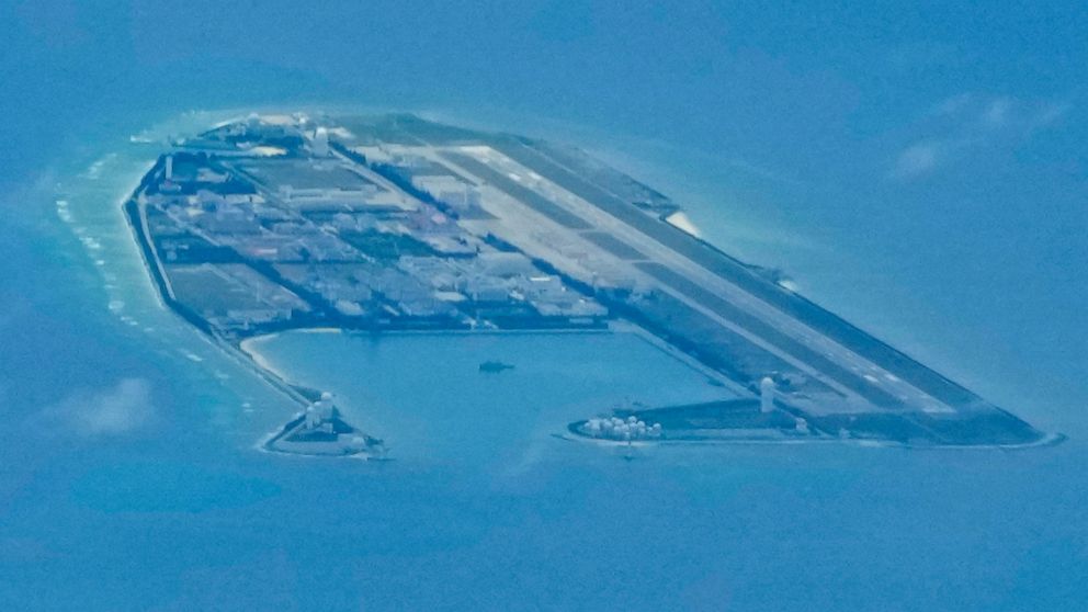 Chinese structures and buildings on the man-made Fiery Cross Reef at the disputed Spratlys group of islands in the South China Sea are seen on March 20, 2022. The Philippine government has summoned a senior Chinese diplomat in Manila to protest the h
