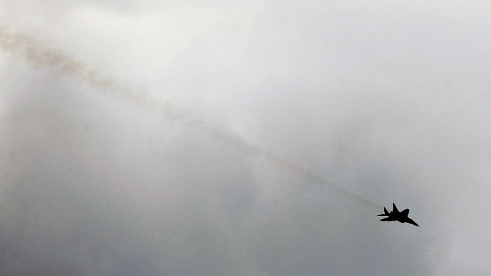 FILE - In this Tuesday, May 9, 2017 file photo, a Serbian army MiG-29 jet fighter performs during exercise at a ceremony marking 72 years since the end of WWII and the defeat of Nazi Germany, at Nikinci training ground, 60 kilometers west of Belgrade