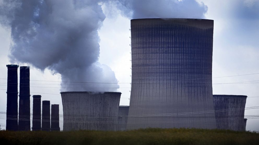 Steam rises out of the cooling towers of the Niederaussem lignite-fired power plant in Pulheim, Germany, Monday, June 20, 2022. The German government said that it remains committed to its goal of phasing out coal as a power source by 2030 despite dee