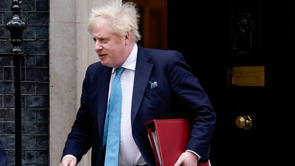 Britain's Prime Minister Boris Johnson leaves 10 Downing Street as he makes his way to parliament, to attend Prime Minister's Questions, in London, Wednesday, Feb. 23, 2022. (AP Photo/Alberto Pezzali)