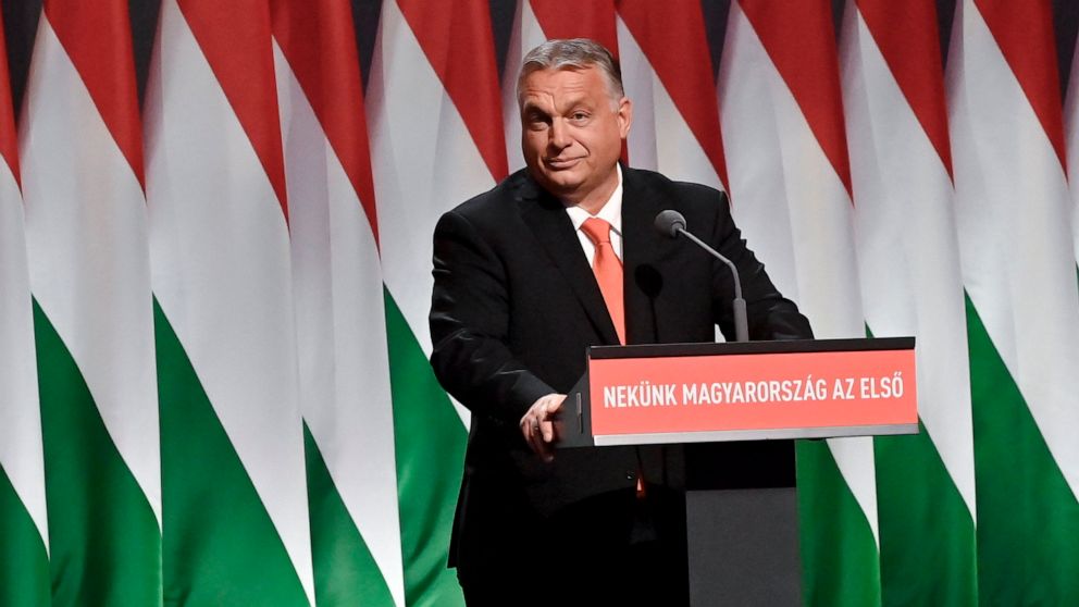 Hungarian Prime Minister Viktor Orban, Chairman of the ruling Hungarian Fidesz party, addresses the 29th congress of Fidesz in Budapest, Hungary, Sunday, Nov. 14, 2021. The inscription reads: For us Hungary is first. (Szilard Koszticsak/MTI via AP)