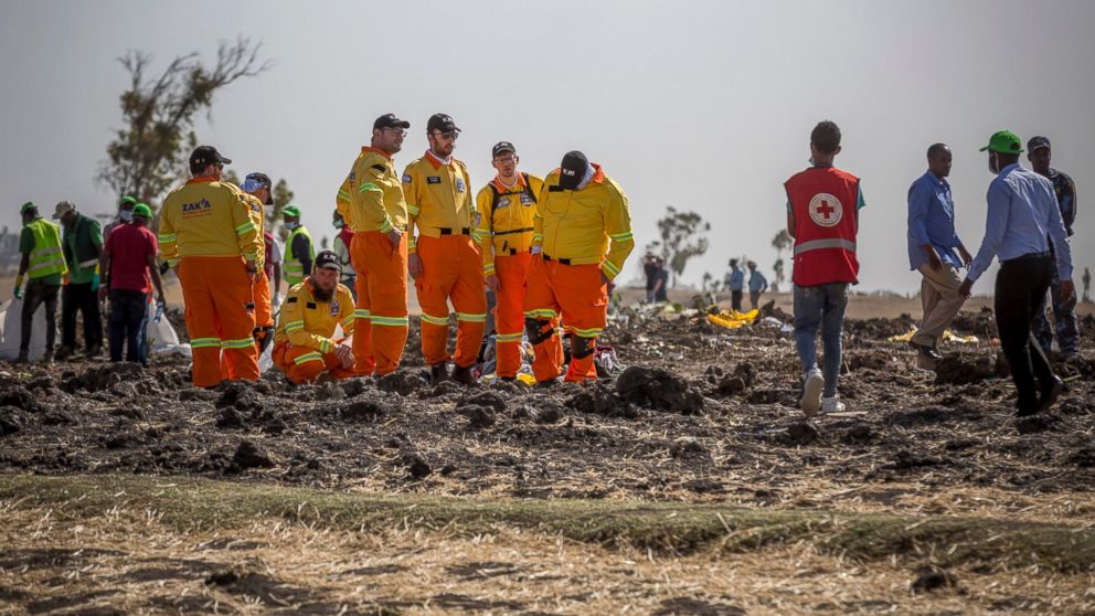 Investigators from Israel examine wreckage at the scene where the Ethiopian Airlines Boeing 737 Max 8 crashed shortly after takeoff on Sunday killing all 157 on board, near Bishoftu, or Debre Zeit, south of Addis Ababa, in Ethiopia Tuesday, March 12, 2019. Ethiopian Airlines had issued no new updates on the crash as of late afternoon Tuesday as families around the world waited for answers, while a global team of investigators began picking through the rural crash site. (AP Photo/Mulugeta Ayene)