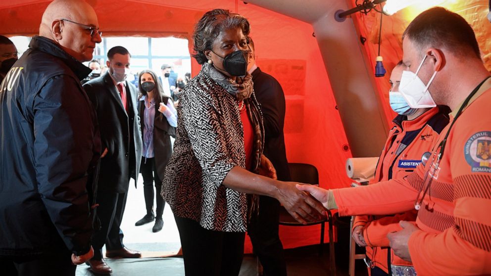 Linda Thomas-Greenfield, United States ambassador to the United Nations shakes hands with volunteers during a visit to a help center that is assisting refugees fleeing the war from neighbouring Ukraine, in Gara de Nord, the main railway station, in B