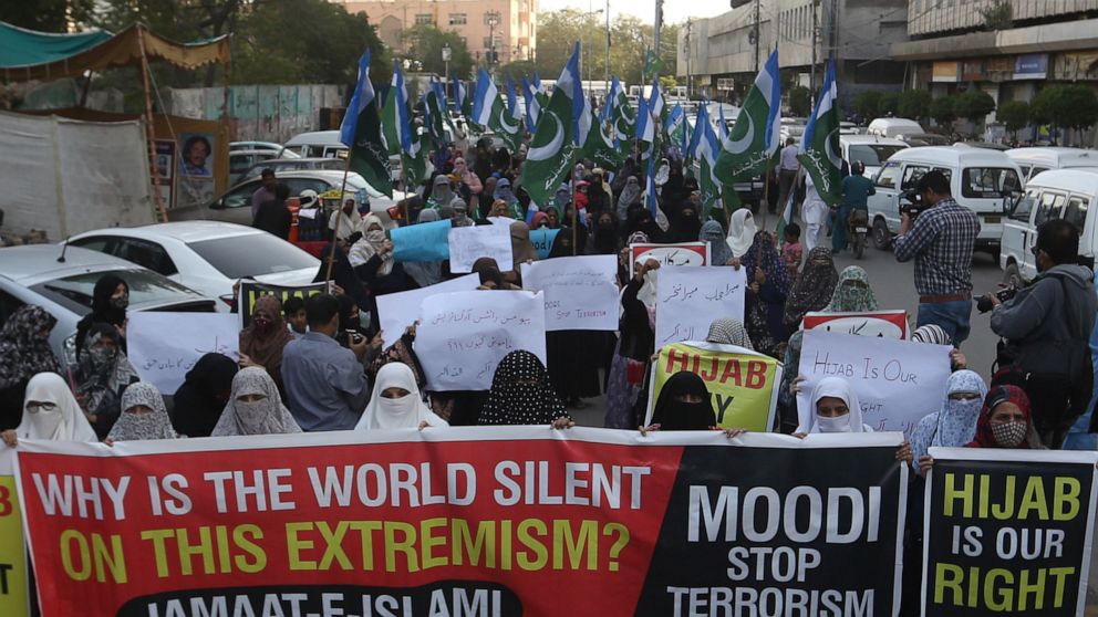 Women supporters of Jamaat-e-Islami take part in demonstration to protest against barring Muslim girls wearing hijab from attending classes at some schools in the southern Indian state of Karnataka, in Karachi, Pakistan, Thursday, Feb. 10, 2022. (AP 