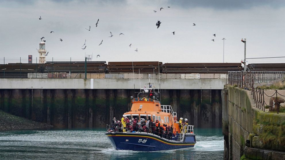 A group of people thought to be migrants are brought in to Dover, on board the Dover lifeboat, following a small boat incident in the Channel, in Kent, England, Thursday, Nov. 11, 2021. (Gareth Fuller/PA via AP)