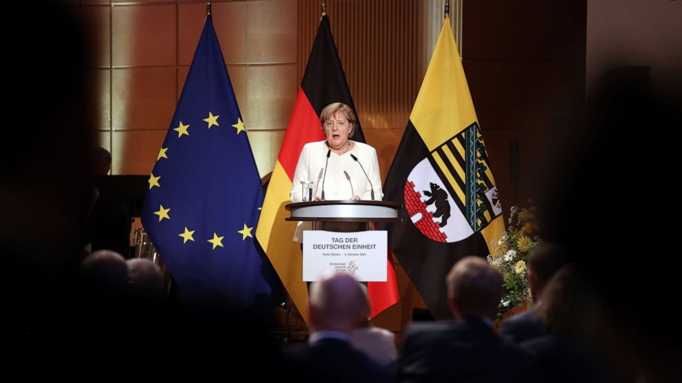 Merkel urges Germans: Keep working for democracy