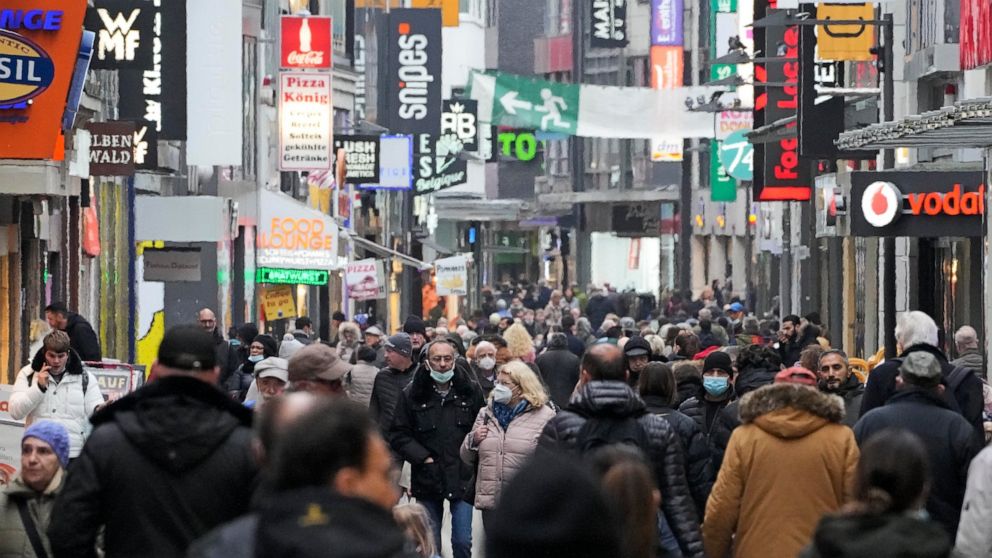 FILE - People fill up the shopping streets in Cologne, Germany, Wednesday, Nov. 17, 2021. Official figures show that consumer prices across the 19 countries that use the euro currency are rising at a record rate. The European Union’s statistics agenc