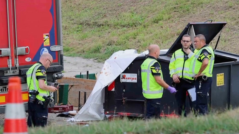 FILE - In this frame grab taken from video, policemen stand at the site where a truck plowed into a gathering in the village of Nieuw-Beijerland, Netherlands, Saturday Aug. 27, 2022. The death toll from a truck accident in the Netherlands rose to sev