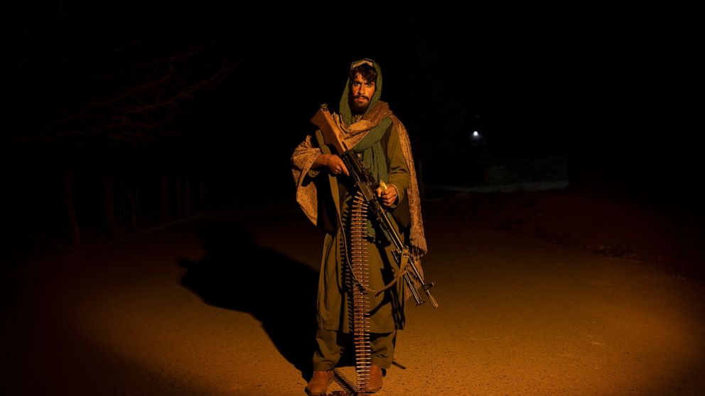 A Taliban fighter poses for a photo at a check point in Herat Afghanistan, on Monday, Nov. 29, 2021. Since the Taliban's takeover of Afghanistan just over three months ago amid a chaotic withdrawal of U.S. and NATO troops, its fighters have changed r