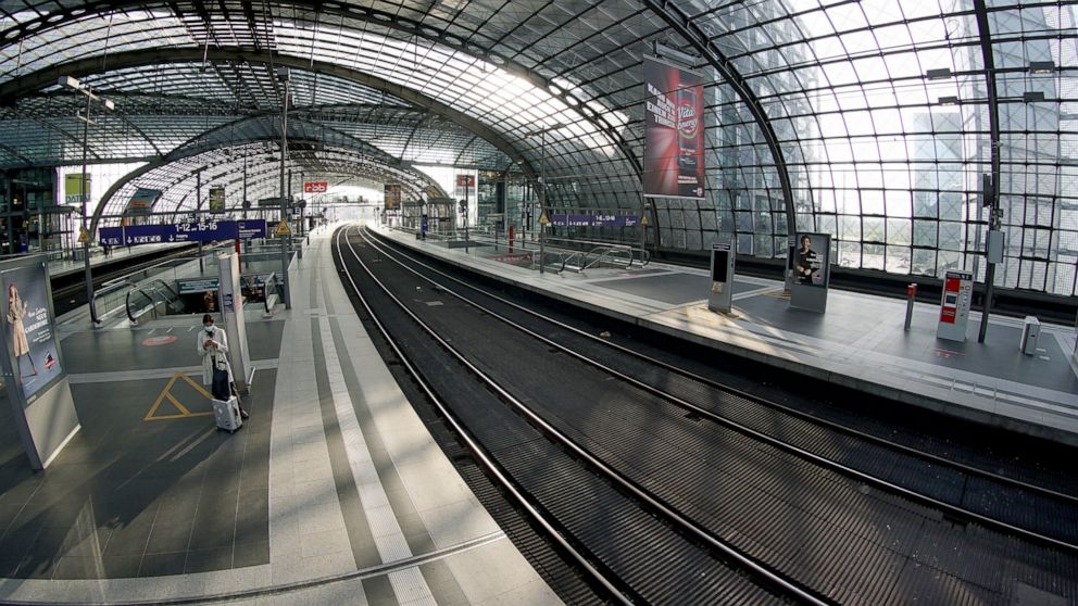 A person stands on an empty station platform at the main station in Berlin, Germany, Thursday, Sept. 2, 2021. A nationwide, five-day train strike has brought big parts of the German railway and commuter system to a standstill. (AP Photo/Michael Sohn)