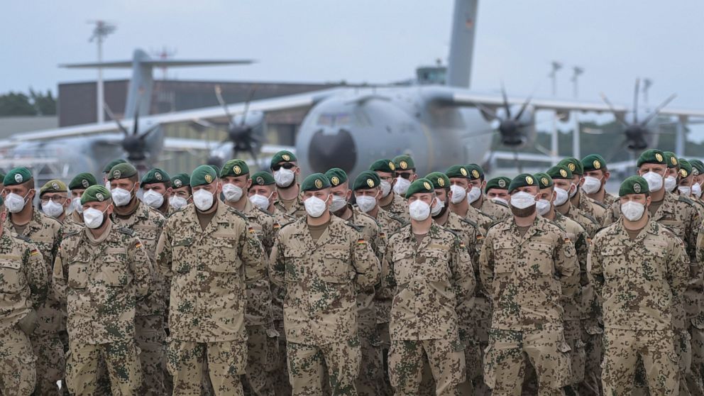 Soldiers of the German Armed Forces have lined up in front of the Airbus A400M transport aircraft of the German Air Force for the final roll call in Wunstorf, Germany, Wednesdat, June 390, 2021. The last soldiers of the German Afghanistan mission hav