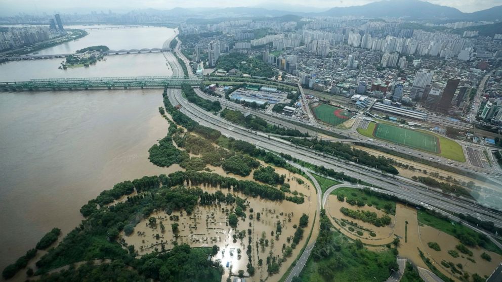 Some parts of a main road along the Han River are flooded due to heavy rain in Seoul, South Korea, Wednesday, Aug. 10, 2022. Cleanup and recovery efforts gained pace in South Korea's greater capital region Wednesday as skies cleared after two days of
