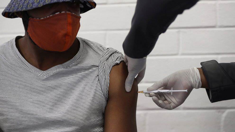 A vaccine volunteer gets an injection at the Chris Hani Baragwanath hospital in Soweto, Johannesburg Wednesday, June 24, 2020. Africa’s first participation in a COVID-19 vaccine trial has begun as volunteers received injections developed at the Unive