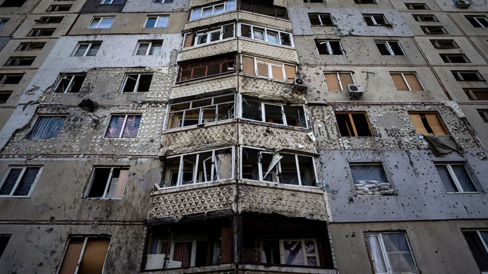 FILE - An apartment building damaged by a Russian attack in Saltivka district in Kharkiv, Ukraine, July 5, 2022. As Russia's invasion of Ukraine grinds into its fifth month, some residents close to the front lines remain in shattered and nearly aband