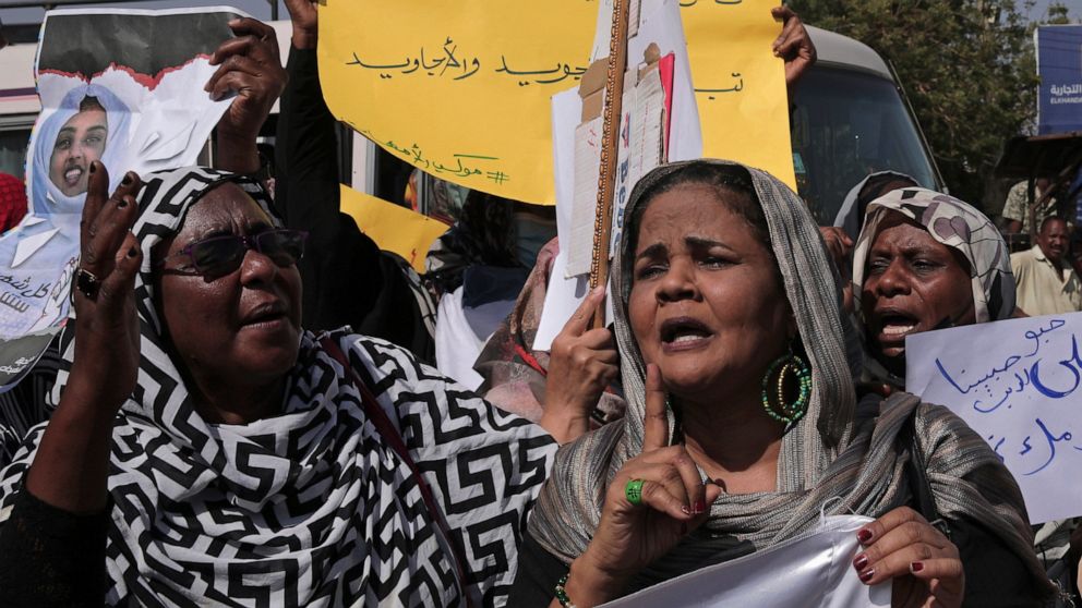 Women chant slogans against the killing of demonstrators in street protests triggered by an October military coup, in the twin city of Omdurman, about 18 miles (30 km) northwest of the capital Khartoum, Sudan, Tuesday, Jan. 11, 2022. The fall coup tr