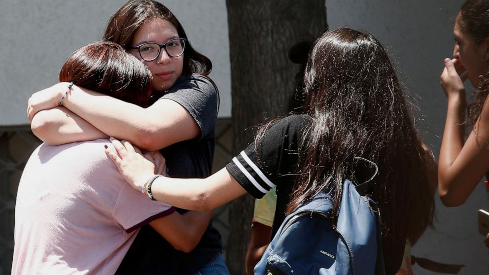 Relatives of passengers of a missing military plane comfort each other as they arrive at the Cerrillos airbase in Santiago, Chile, Tuesday, Dec. 10, 2019. Chile's air force said it lost radio contact with a C-130 Hercules transport plane carrying 38 