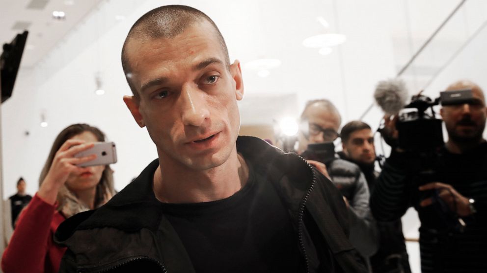 FILE - In this Jan. 10, 2019 file photo, Russian performance artist Pyotr Pavlensky arrives at the Paris courthouse, as he goes on trial after he set fire to the facade of France's central bank in Paris. Pyotr Pavlensky, noted for macabre, politicall
