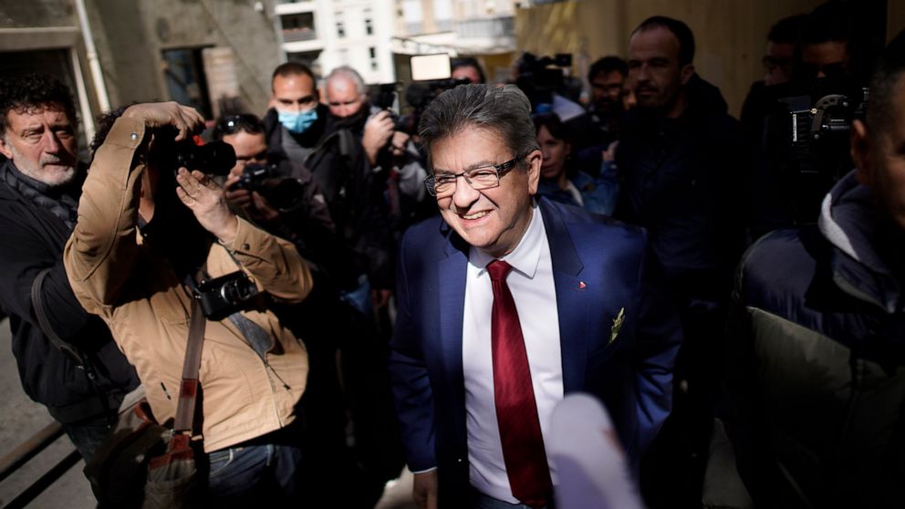 FILE- French far-left candidate Jean-Luc Melenchon leaves after voting in the first round of the presidential election at a polling station, April 10, 2022 in Marseille, southern France. A month before the first round of voting, the campaign for the 