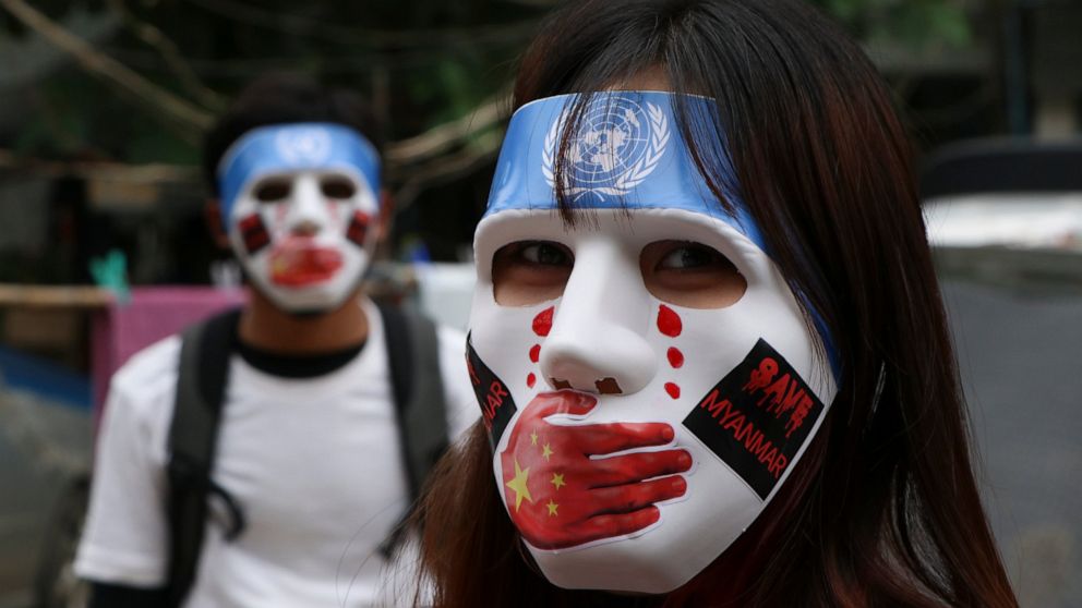 FILE - In this April 4, 2021, file photo, young demonstrators participate in an anti-coup mask strike in Yangon, Myanmar. Many in Myanmar have found a safer, more substantive way to protest the country’s military coup. Instead of facing down heavily 